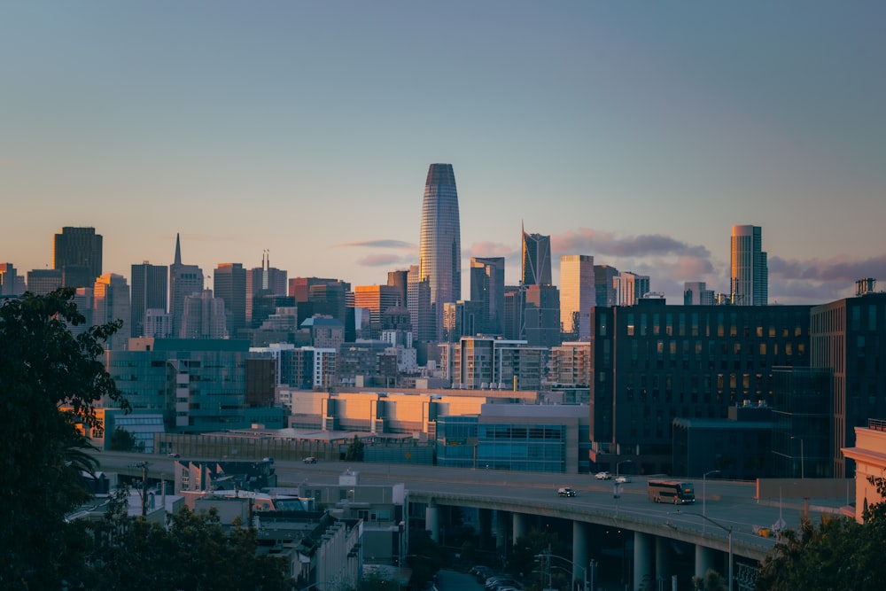 a city skyline with a bridge