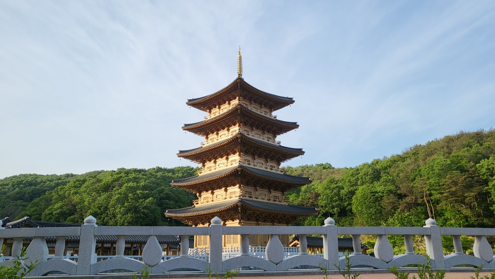 a pagoda with trees in the background