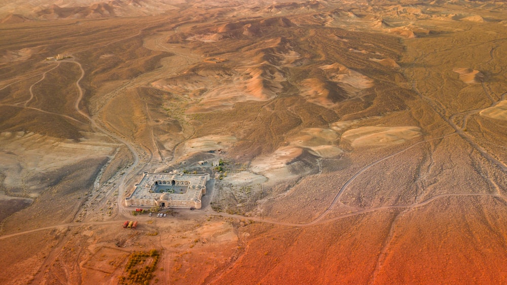 a truck driving through a desert