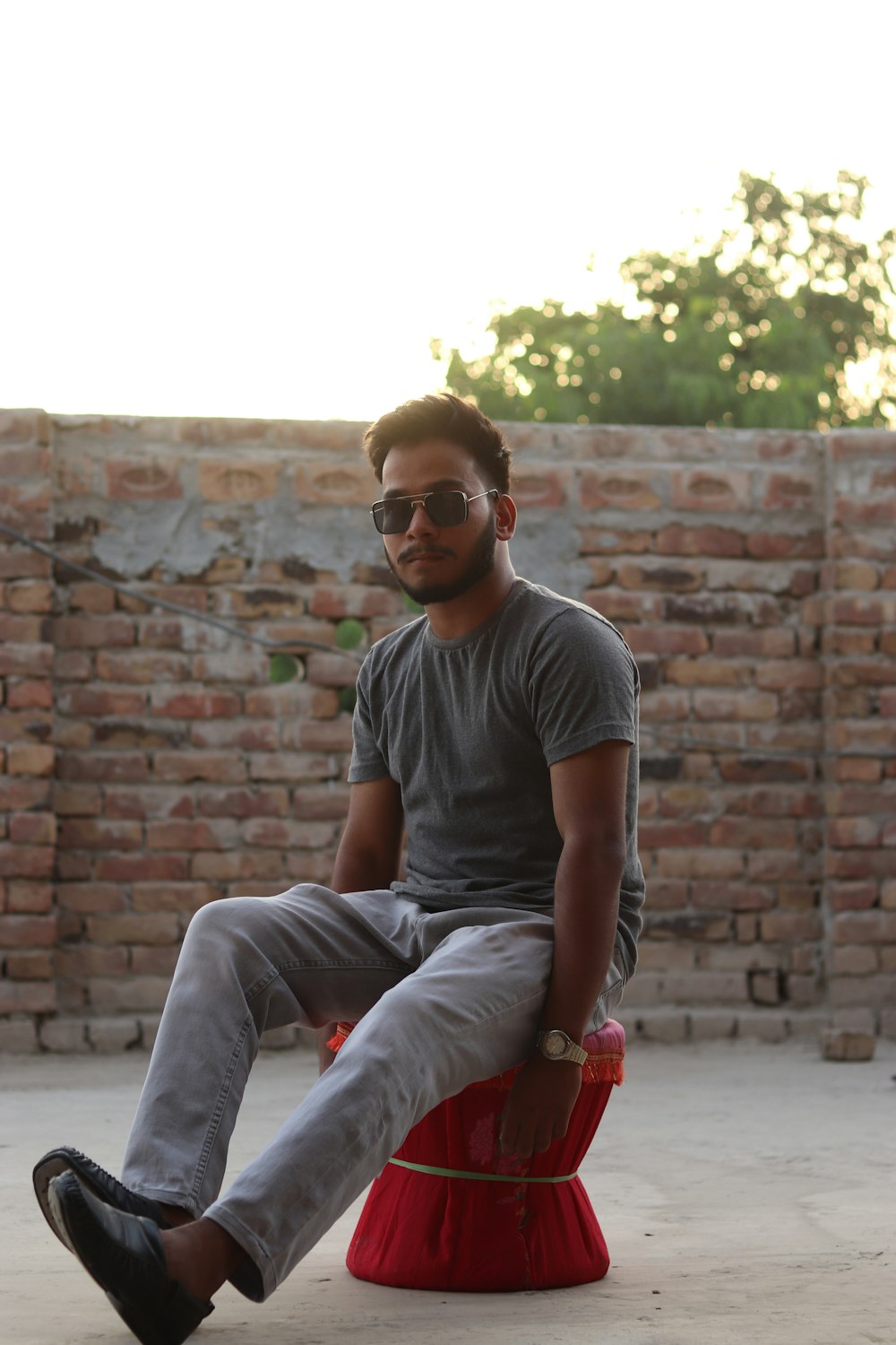 a man sitting on a red chair