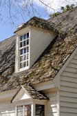 Before and after comparison of a roof renovation completed by dh couvreur 27.