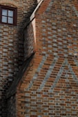 a brick wall with a window