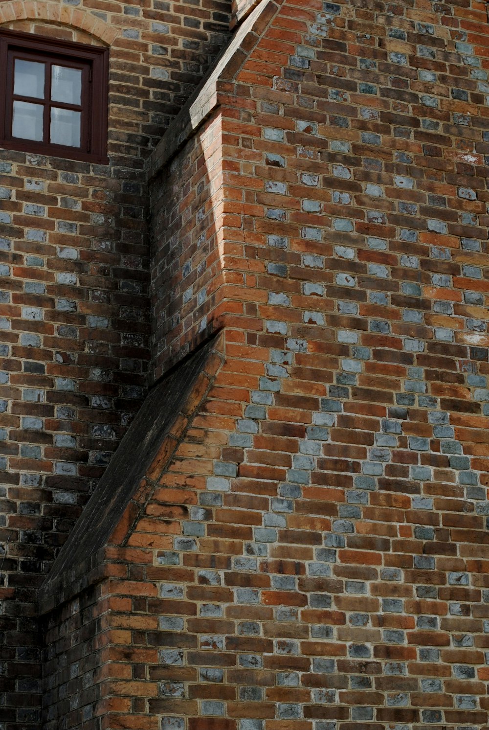 a brick wall with a window