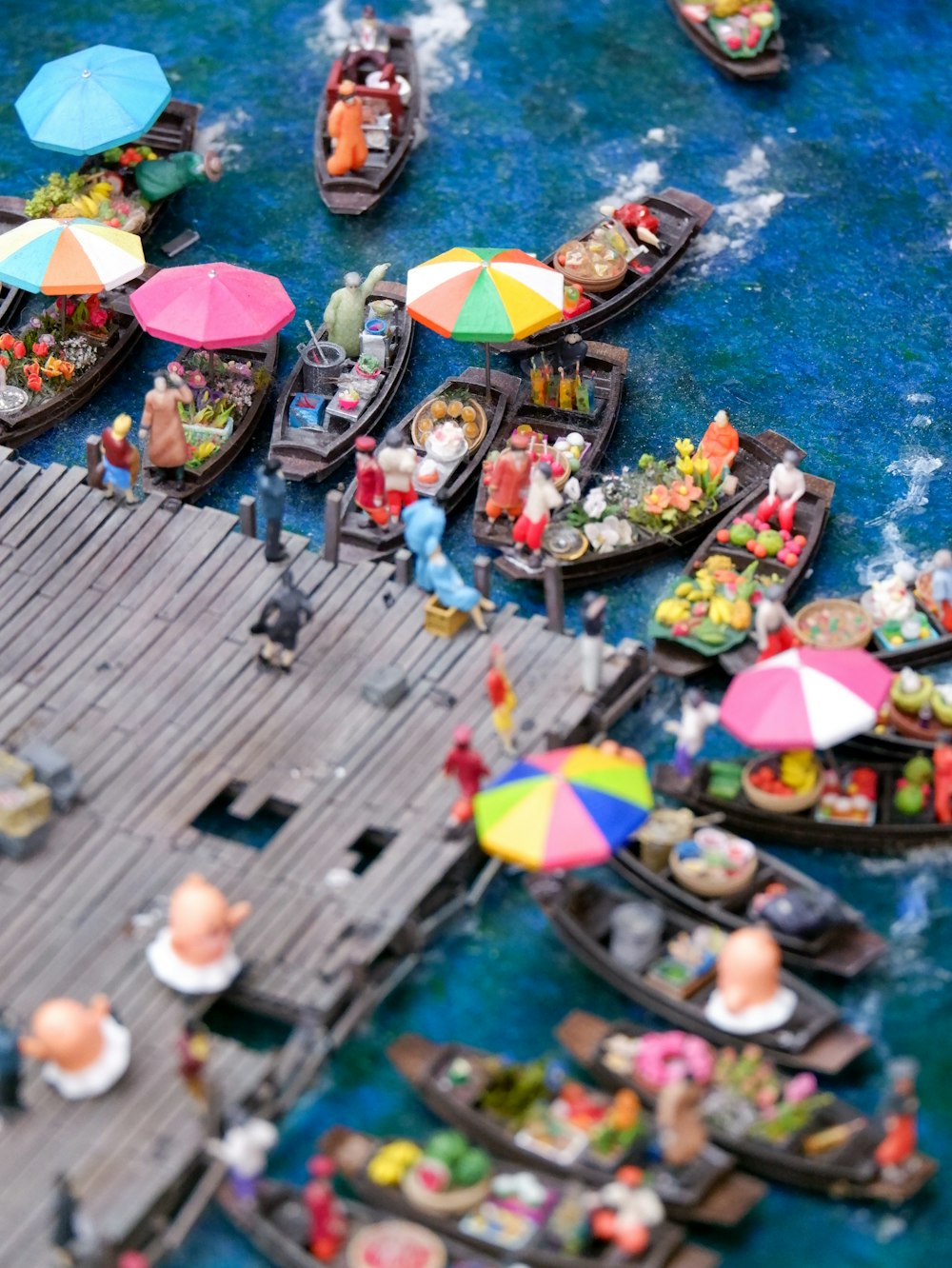 a boat full of people with umbrellas