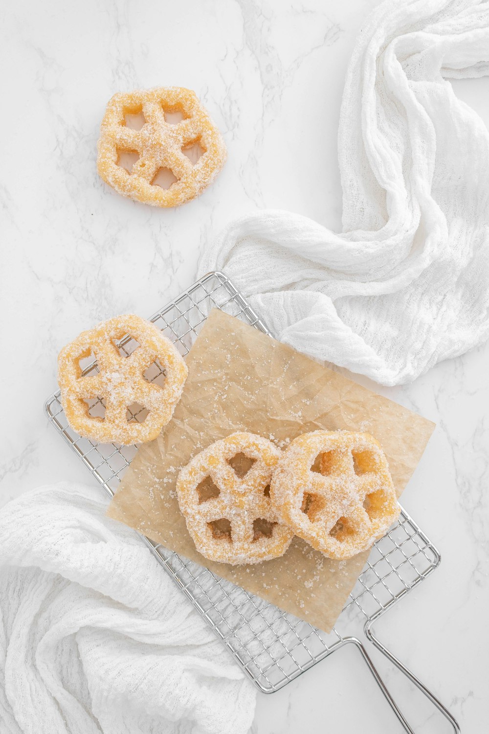 a group of cookies on a cooling rack