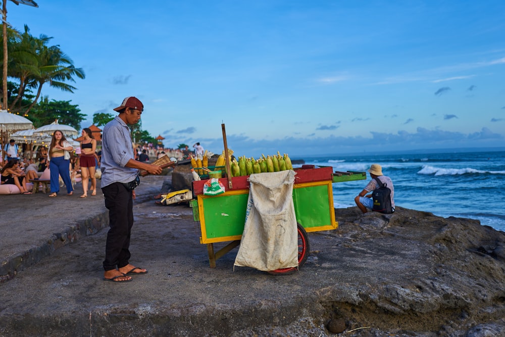 a person selling food on a beach