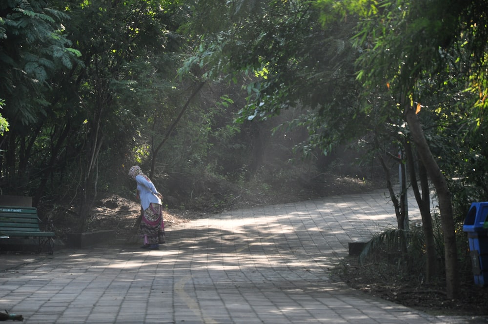 a person walks down a sidewalk