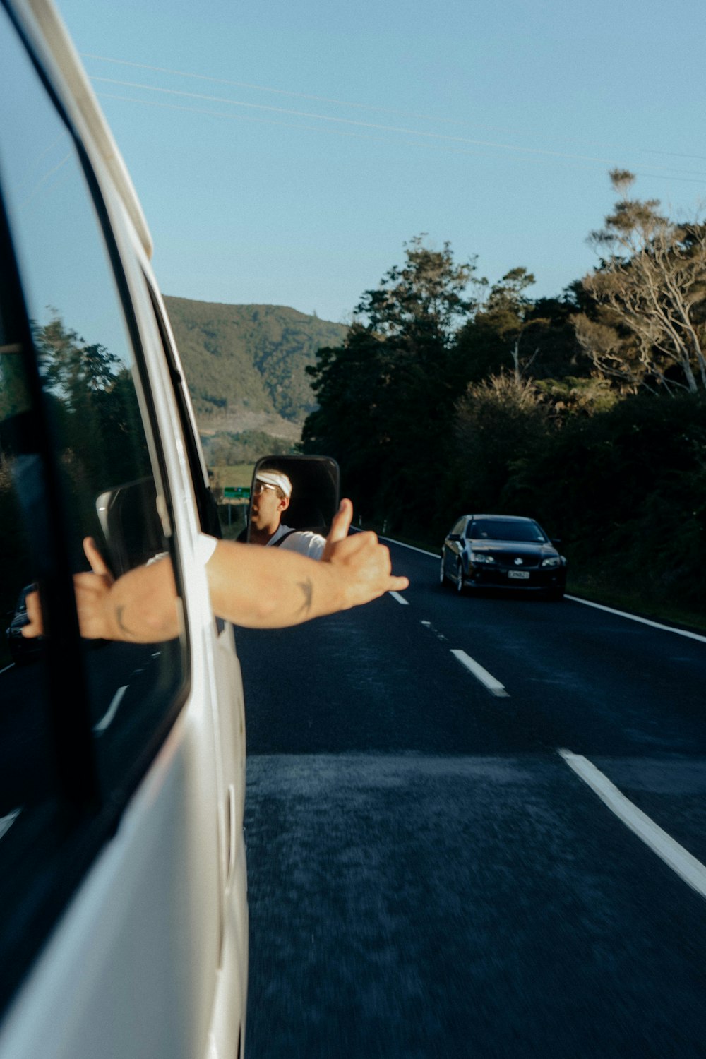 a person taking a selfie in a car