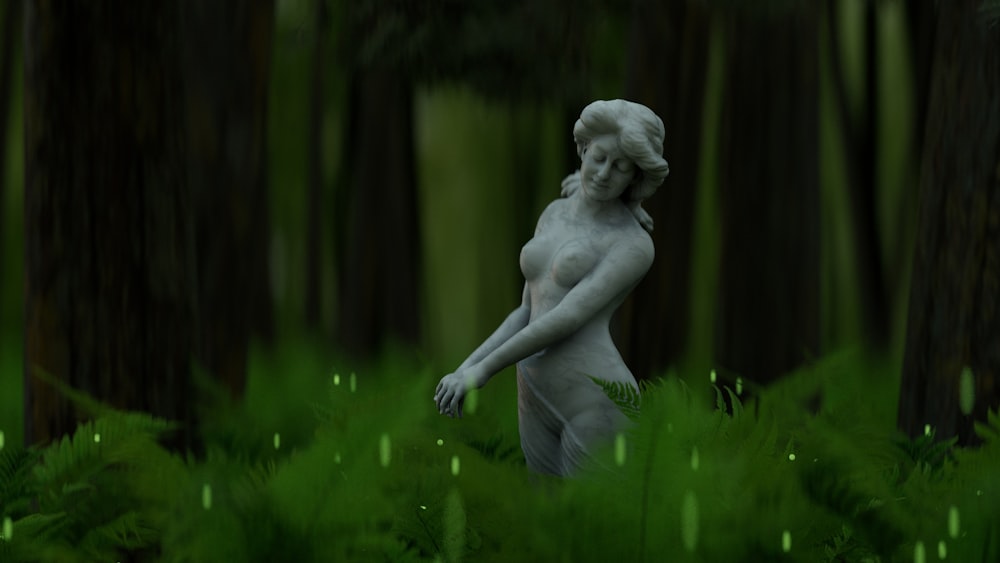 a statue of a person in a forest