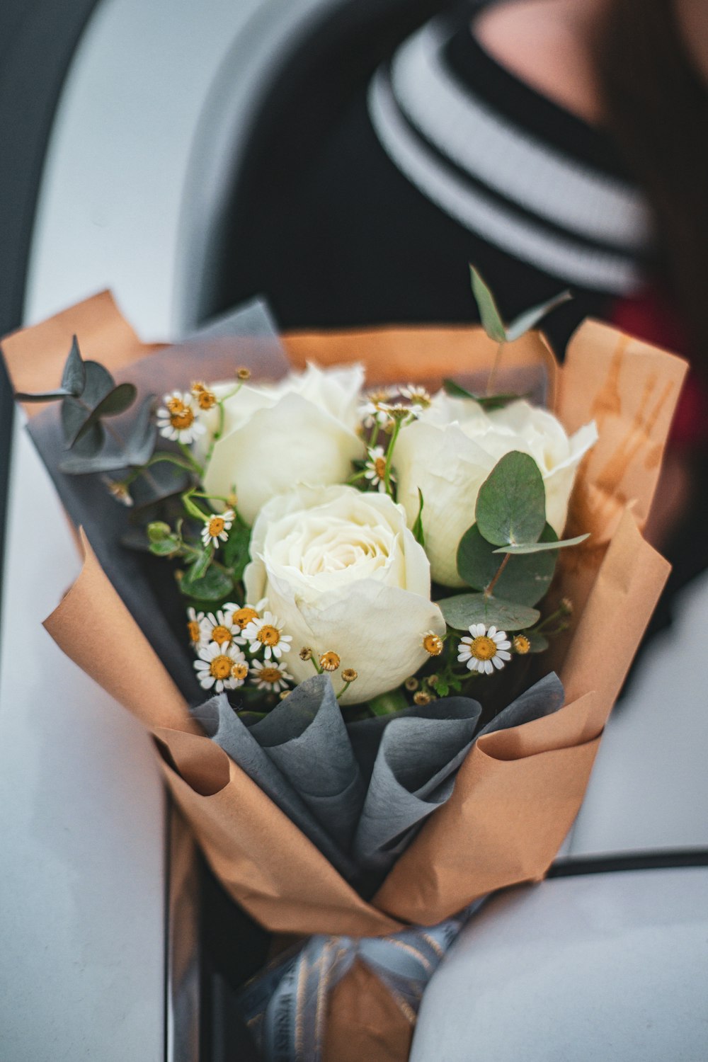 a person holding a bouquet of flowers