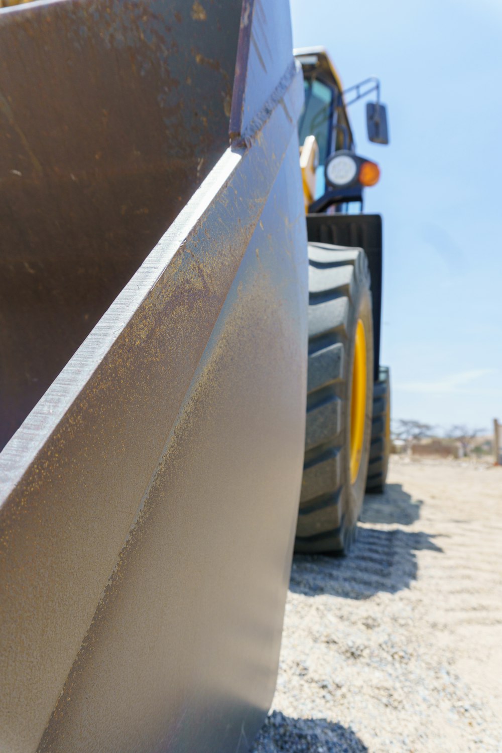 a yellow school bus parked on a dirt road