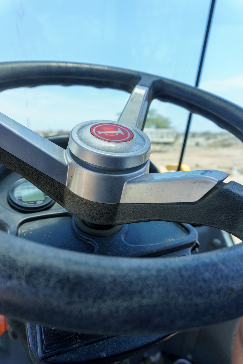 a steering wheel and dashboard of a car