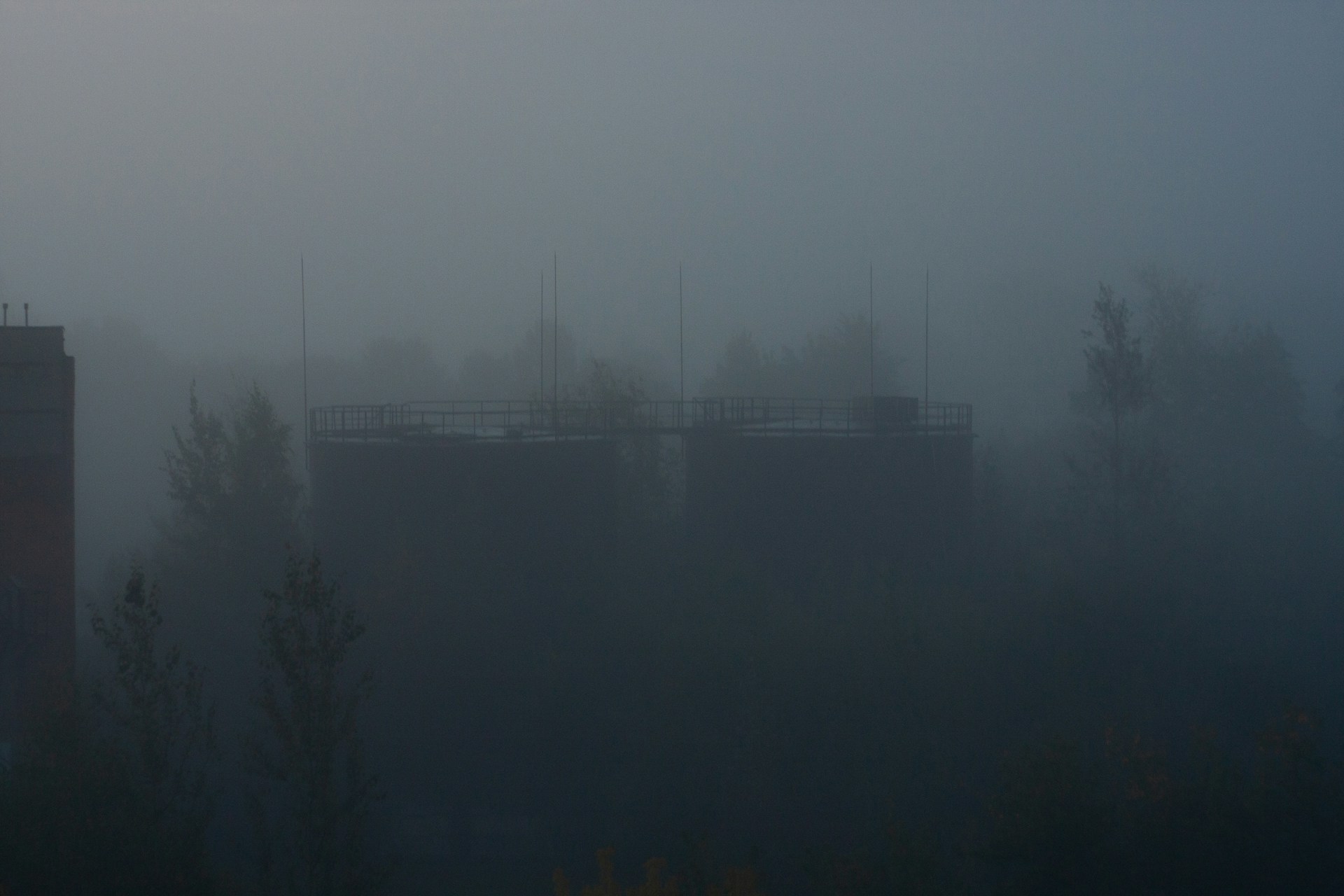 a foggy view of a bridge