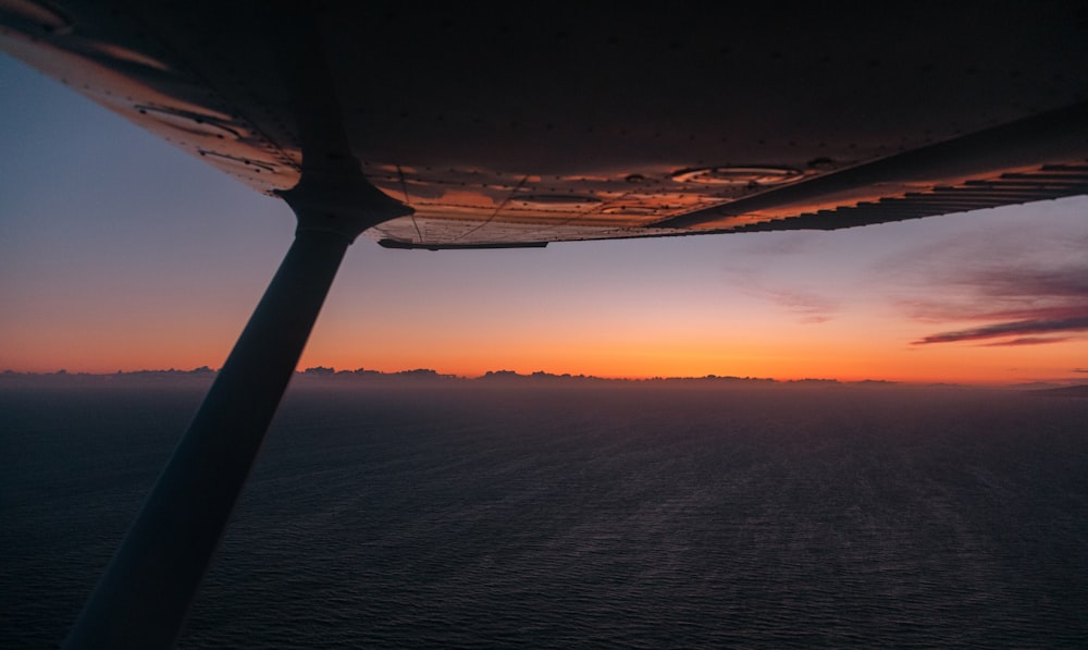 a view of the sunset from a plane window