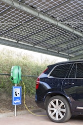 a car parked next to a parking meter
