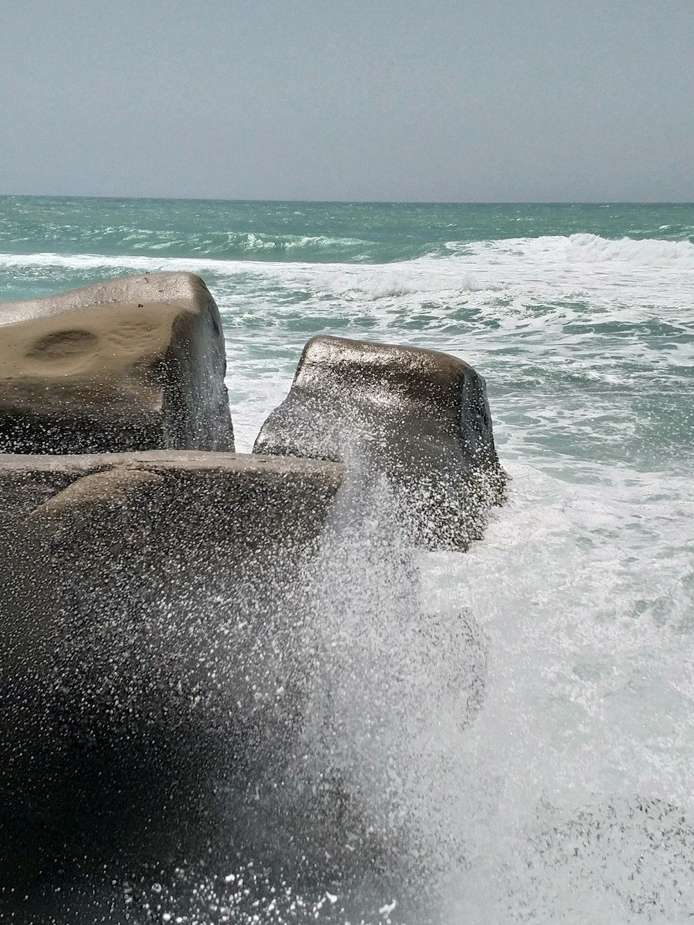 a group of rocks in the water