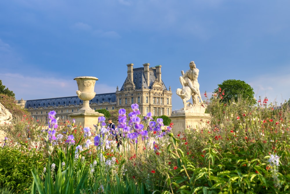 a colorful flower garden in front of a building