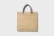 A plain beige tote bag with a textured surface, featuring a sturdy handle made of twisted grey rope.