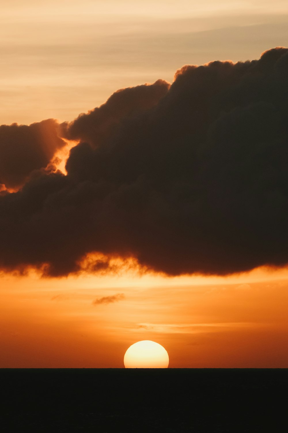 a sunset over a mountain range