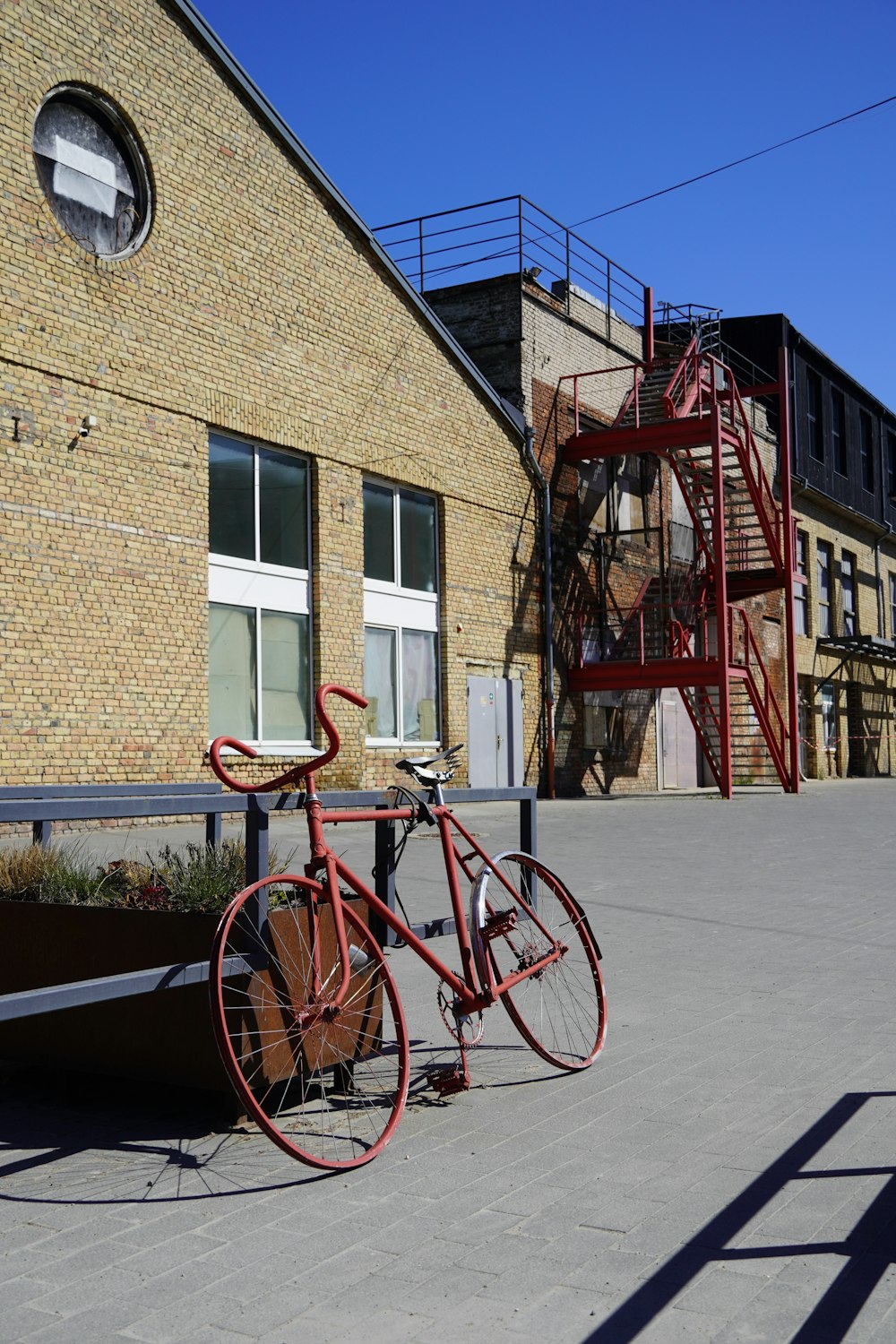 a bicycle parked on a sidewalk