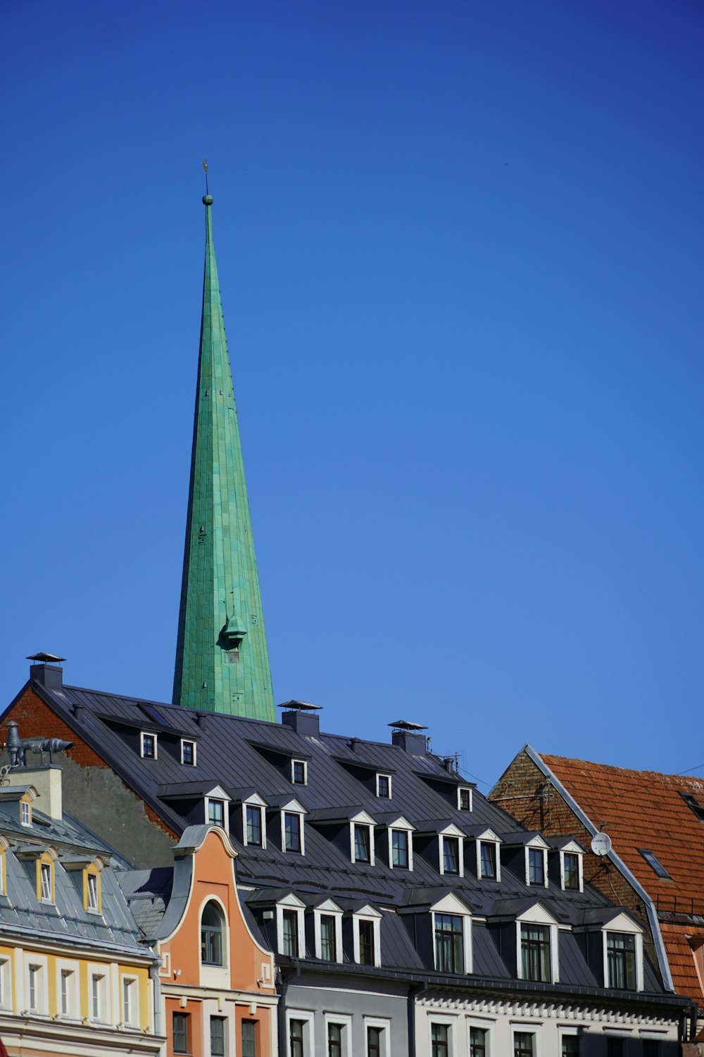 a tall building with a pointed roof