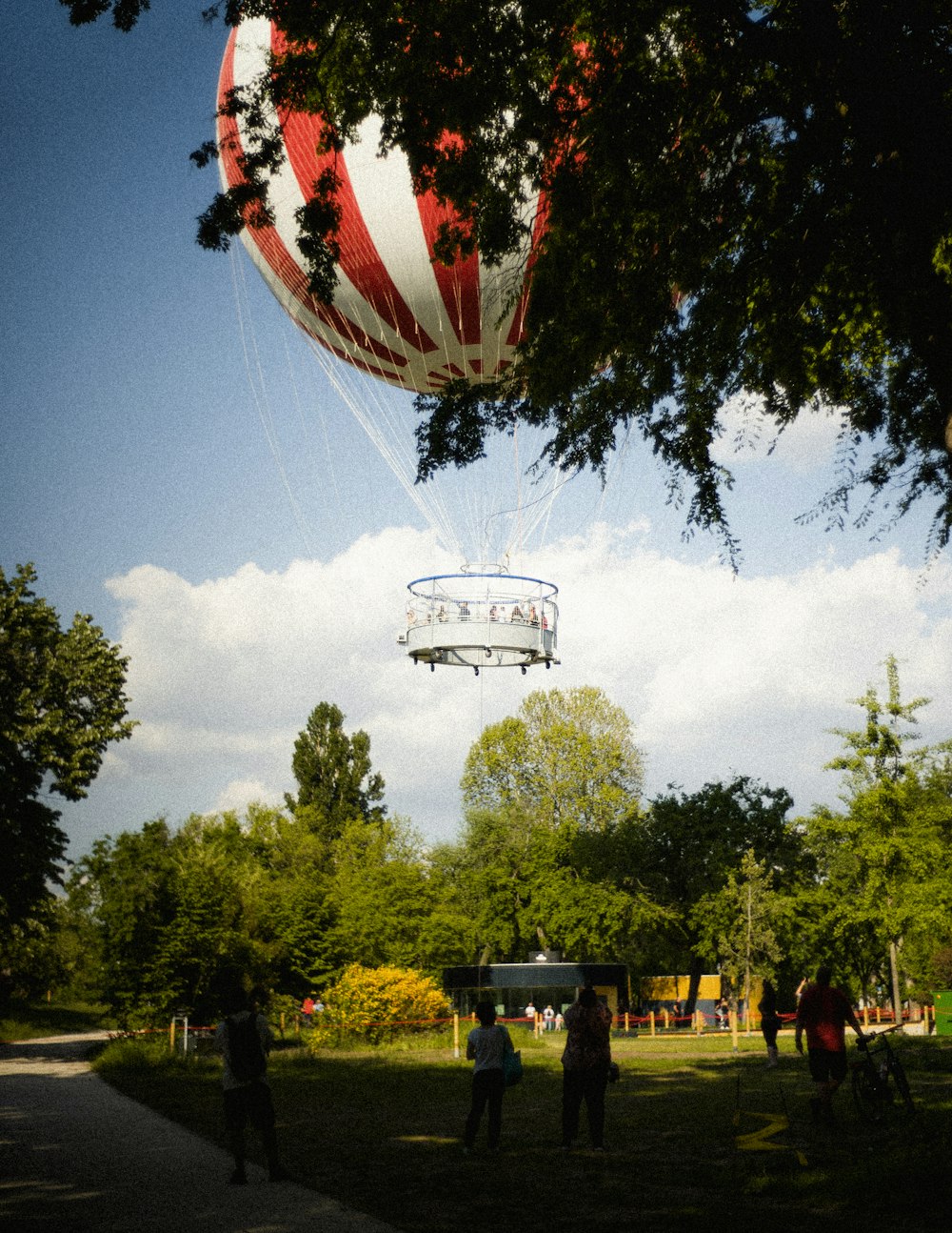 a helicopter flying over a park