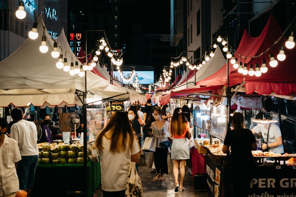 people walking in a market