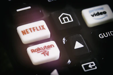 A close-up of a hand navigating an IPTV reseller panel on a laptop.