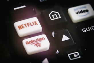 A close-up of a hand navigating an IPTV reseller panel on a laptop.
