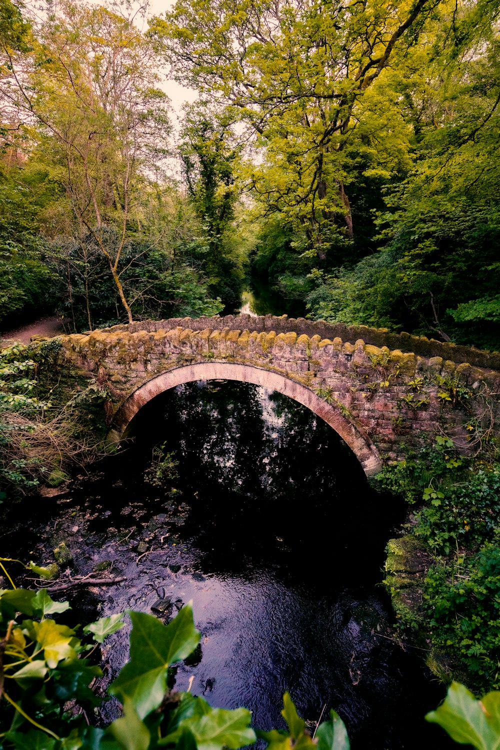 a stone bridge over a river