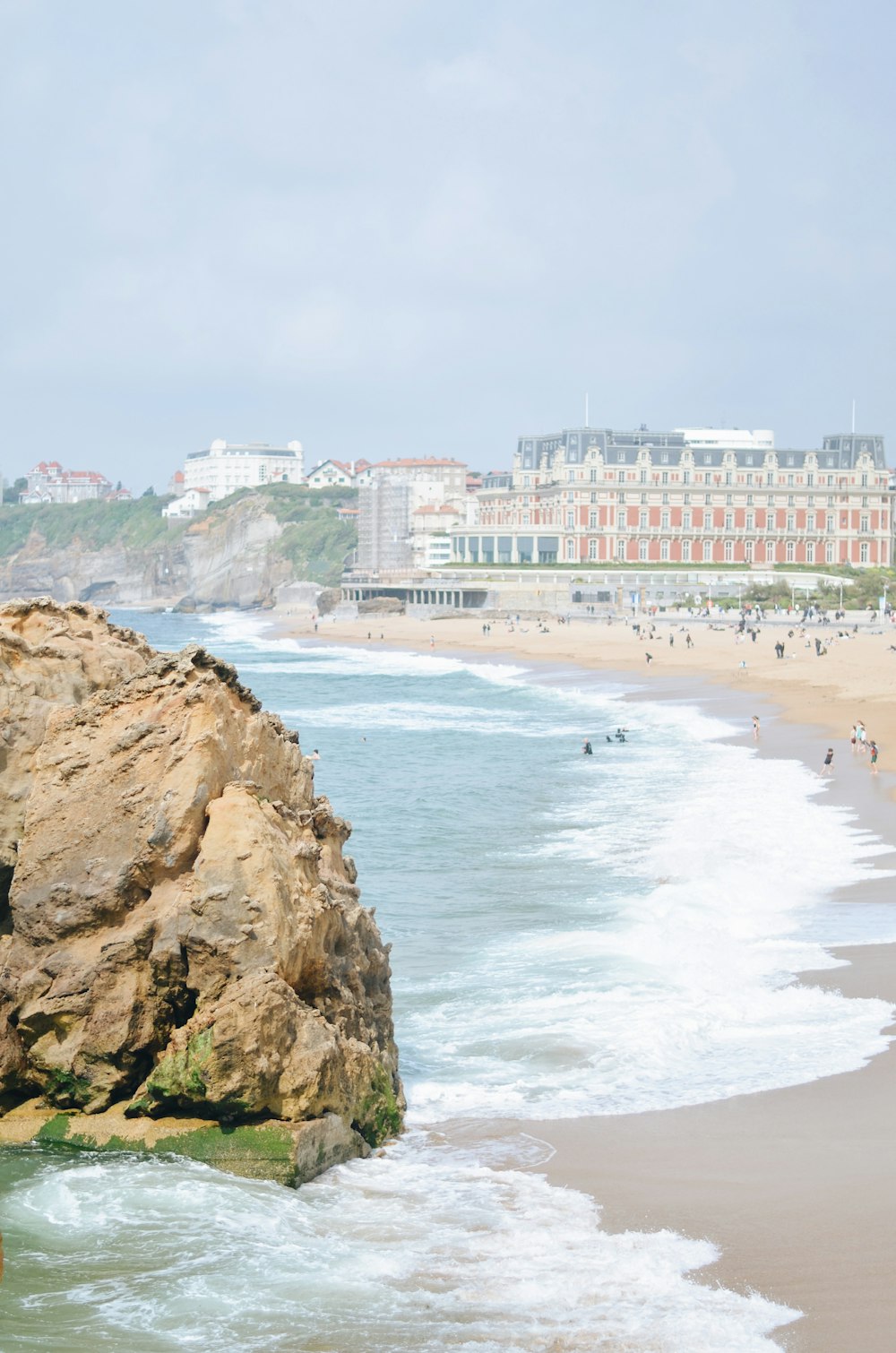 a beach with people on it