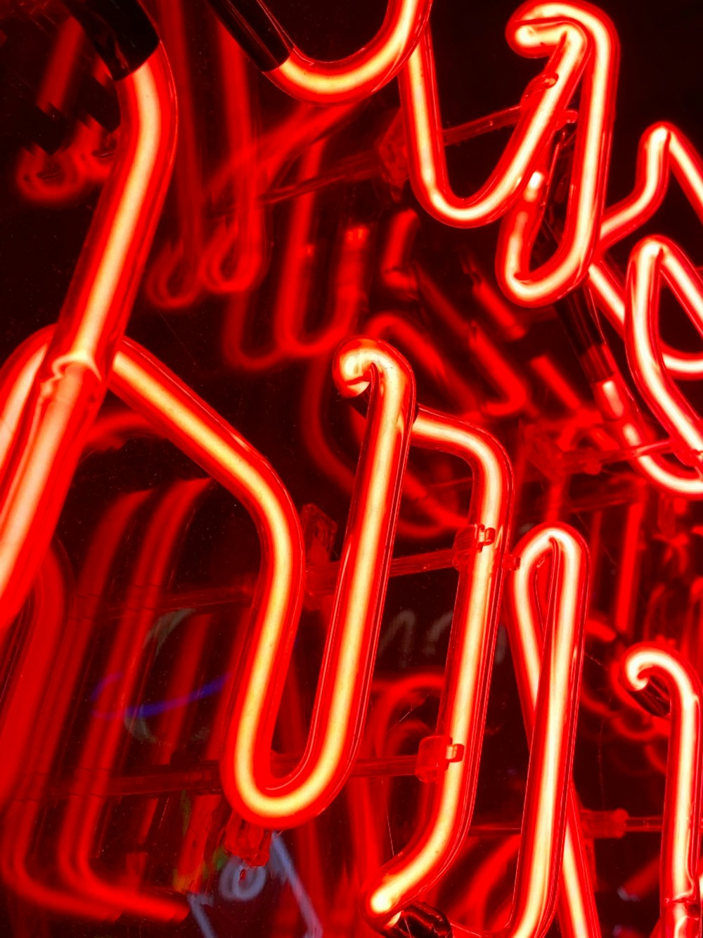 a neon sign with red lights