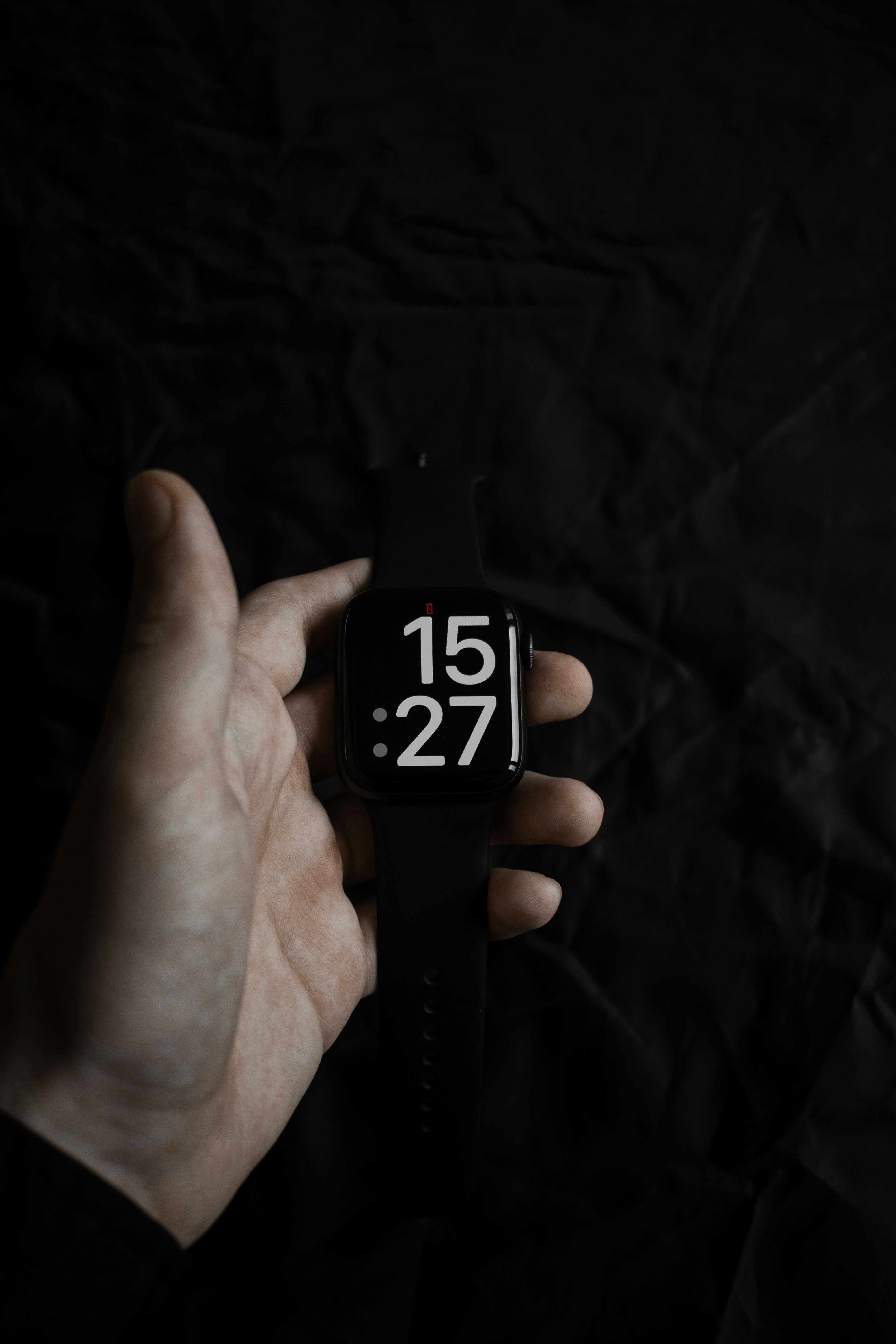 a hand holding a black and white lighter