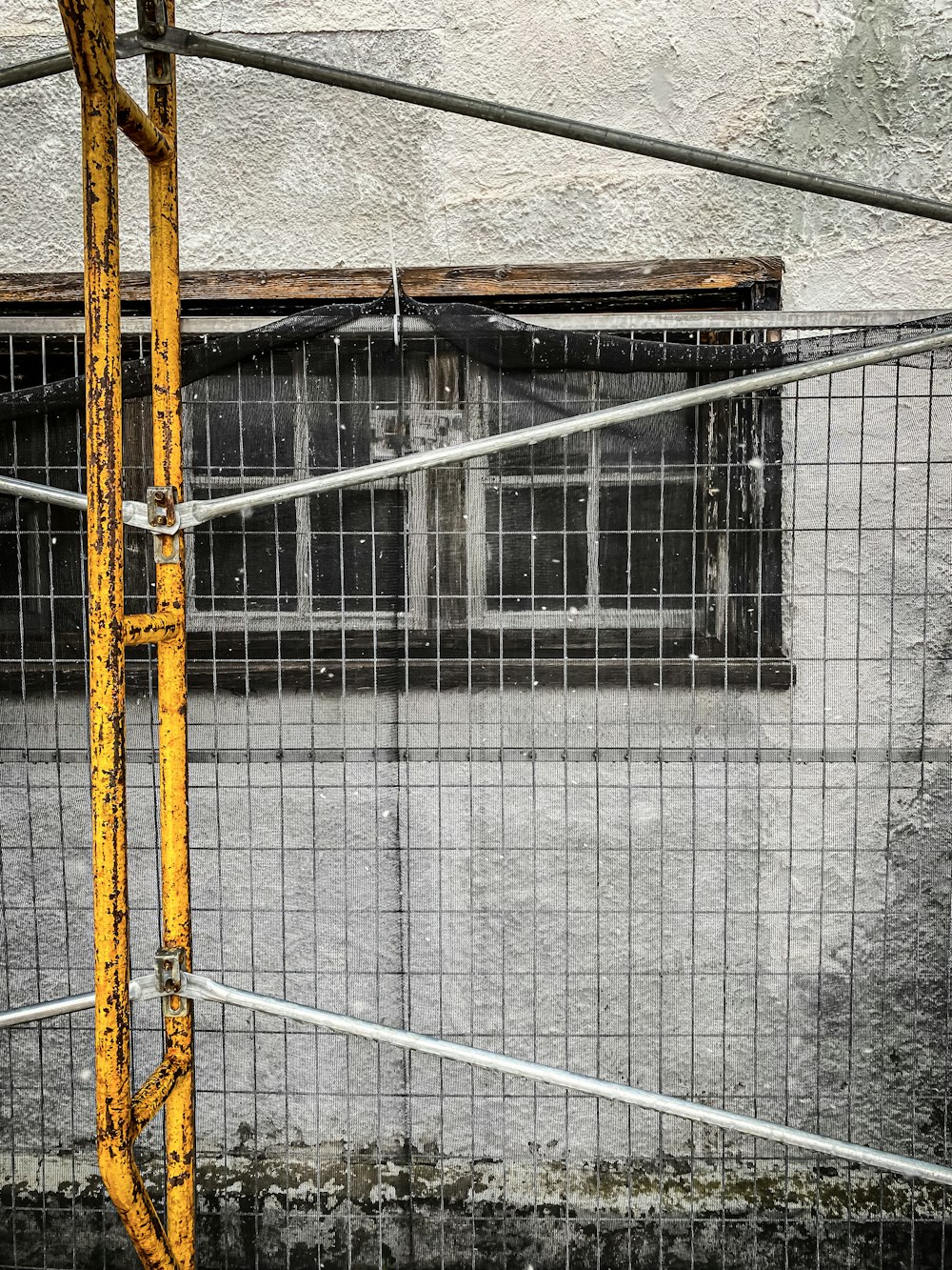 a metal fence with a metal frame