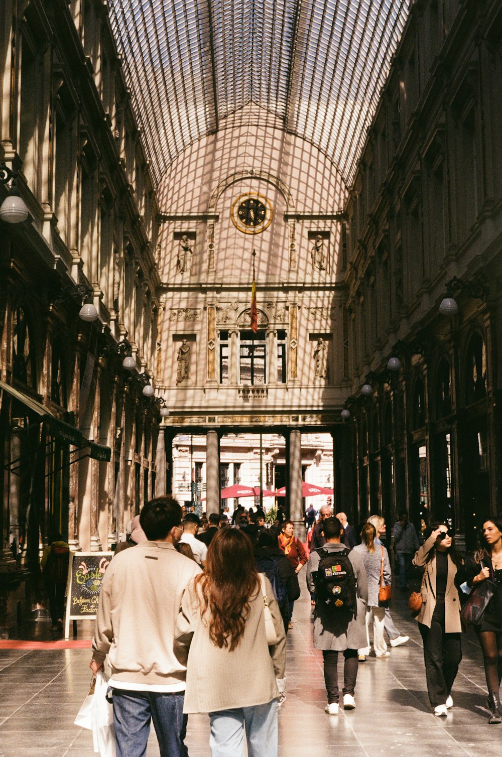 people walking in a large building