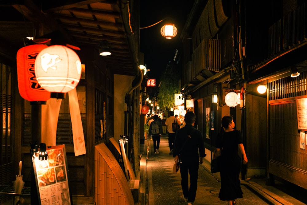 people walking down a sidewalk