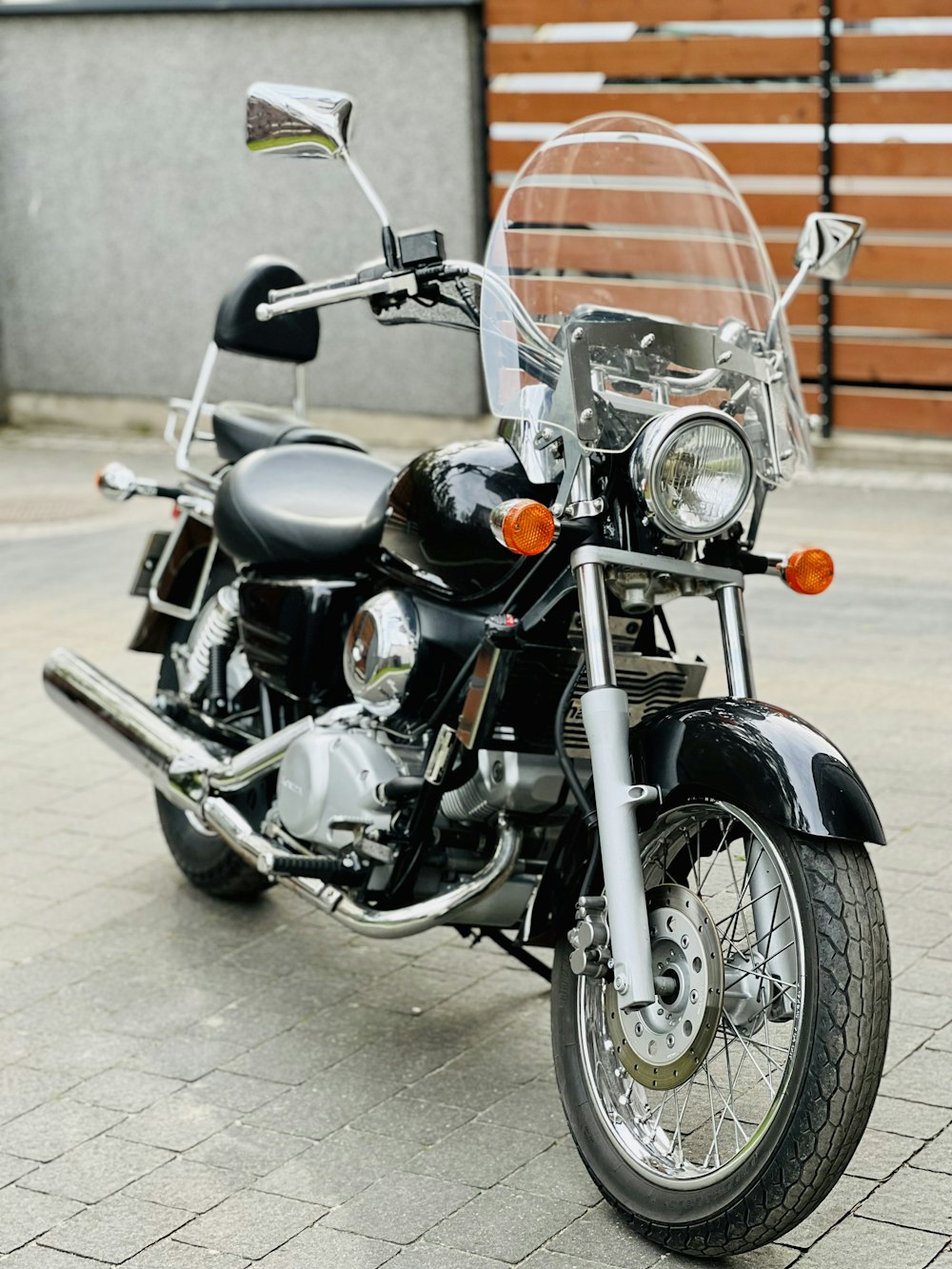 a motorcycle parked on a sidewalk