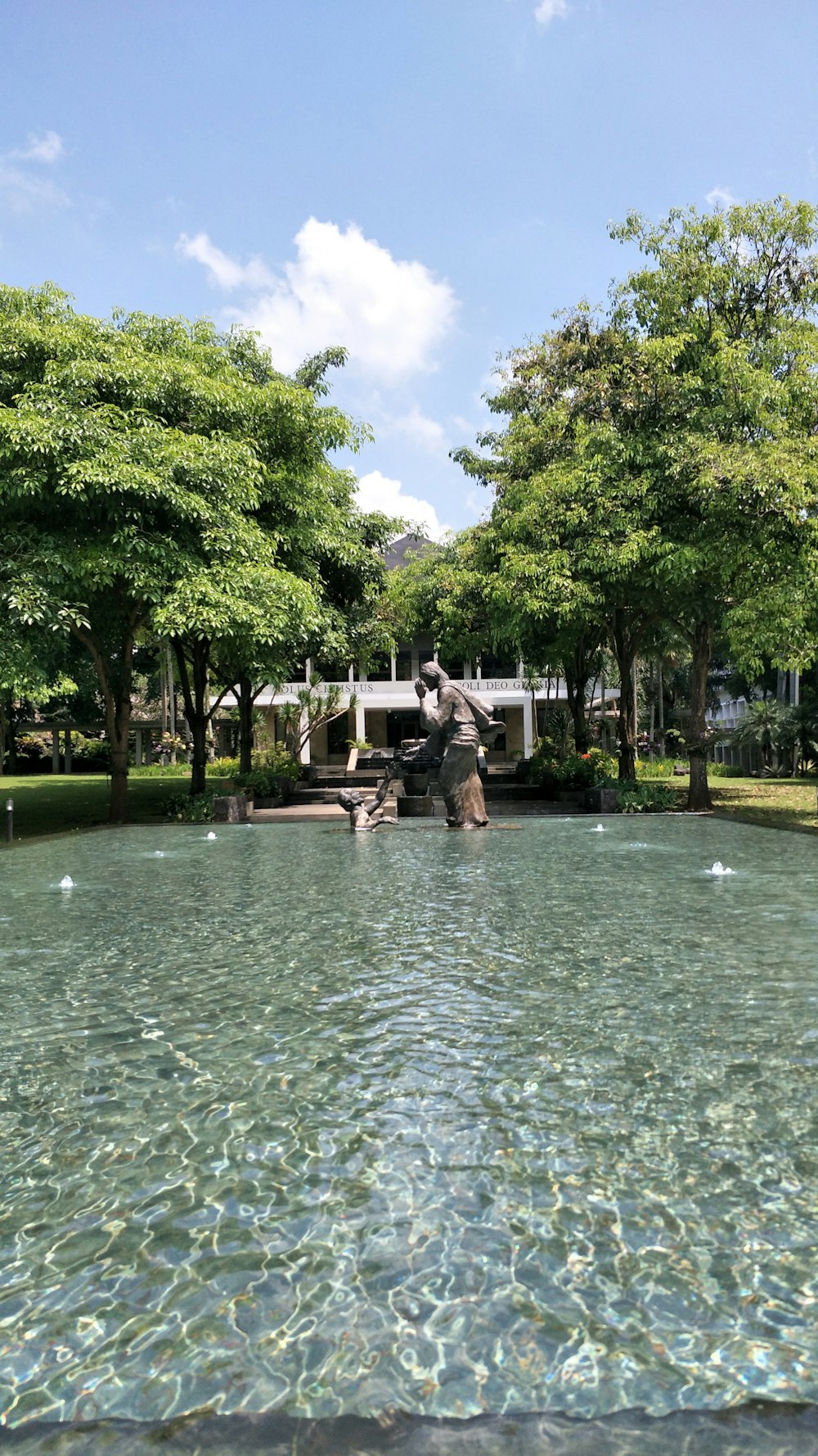 a statue in a pond