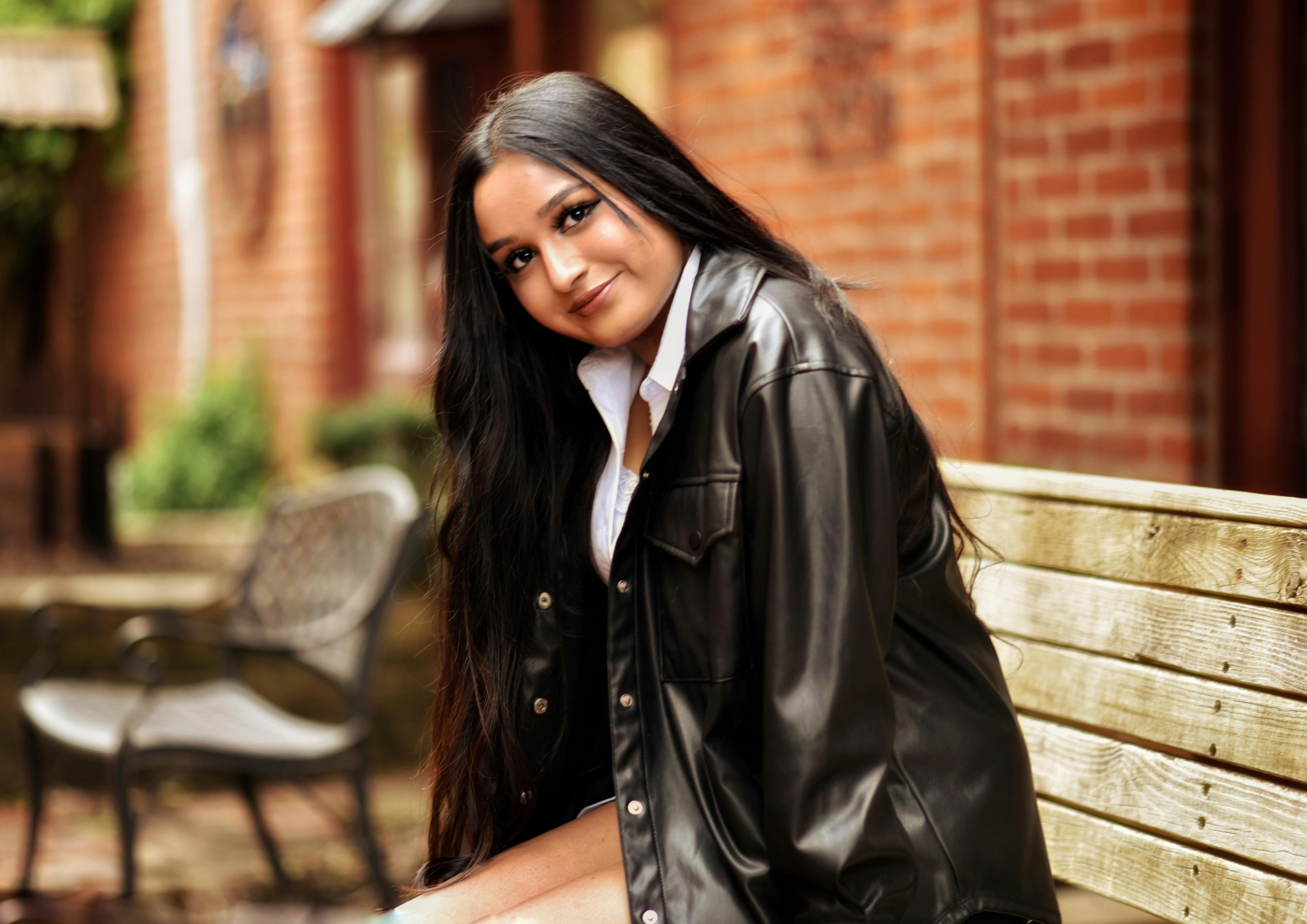 a woman sitting on a bench