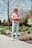 a person standing on a sidewalk