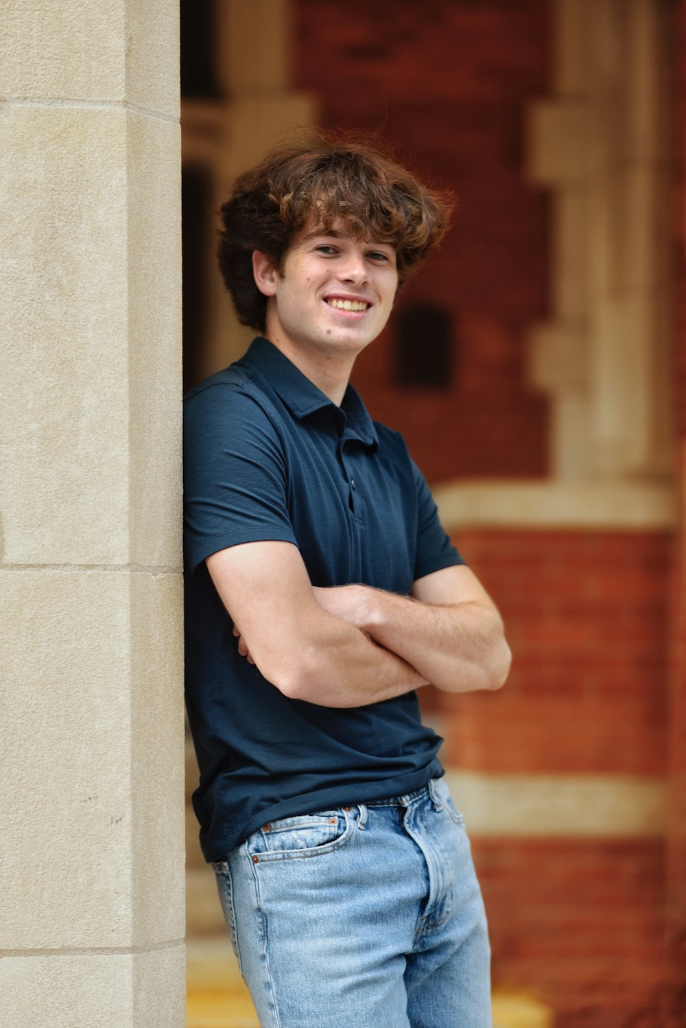 a man leaning against a wall