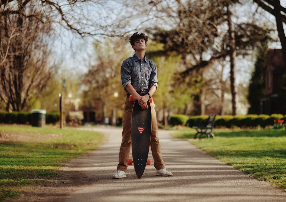 a person holding a skateboard