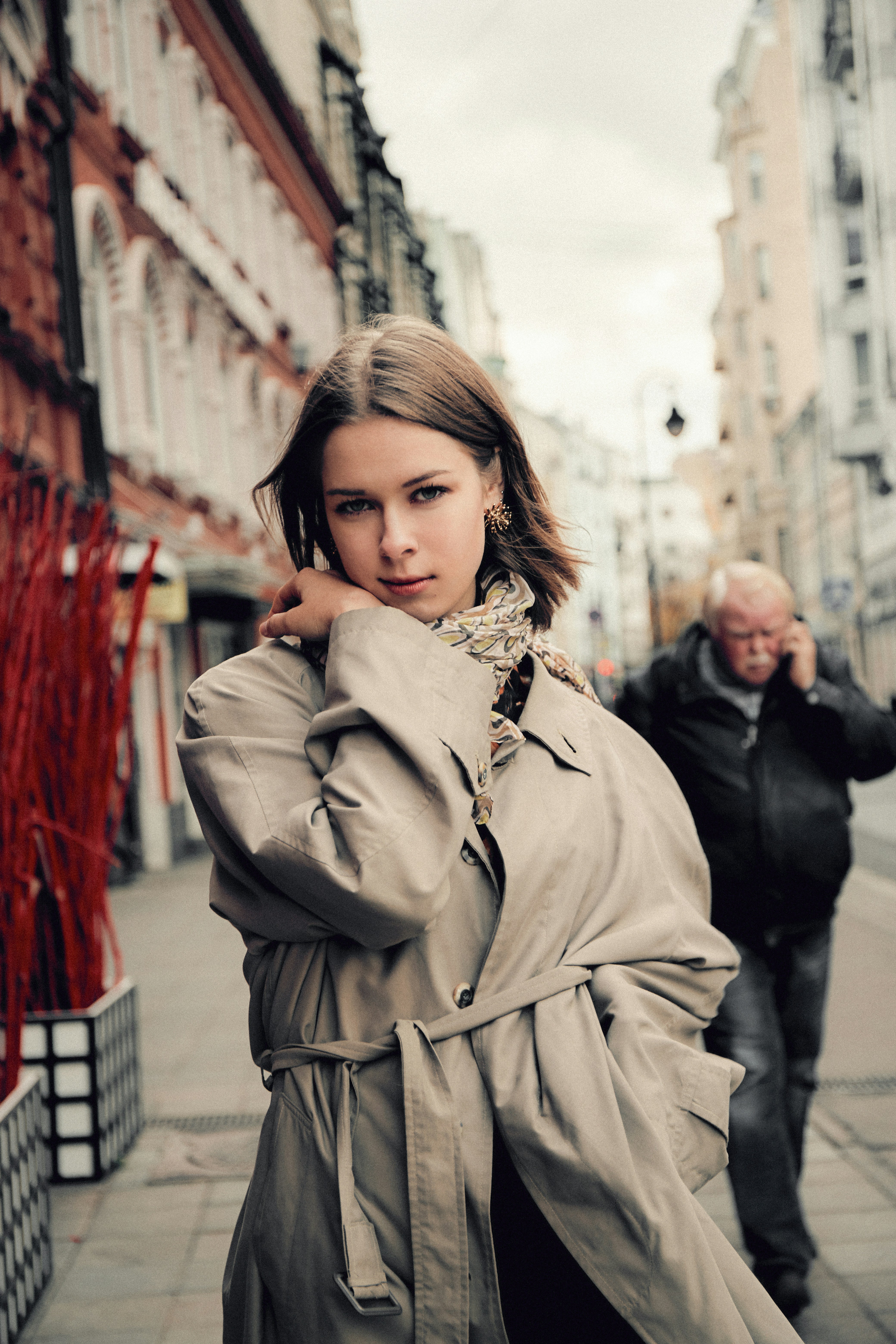 a person in a trench coat