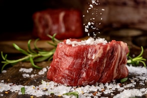 a piece of meat with a red substance on it