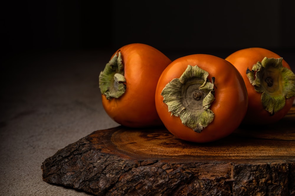 a group of pumpkins on a wood surface