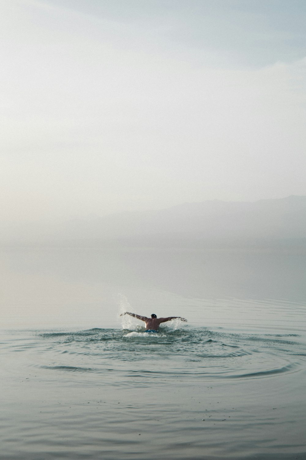 a person surfing on the waves