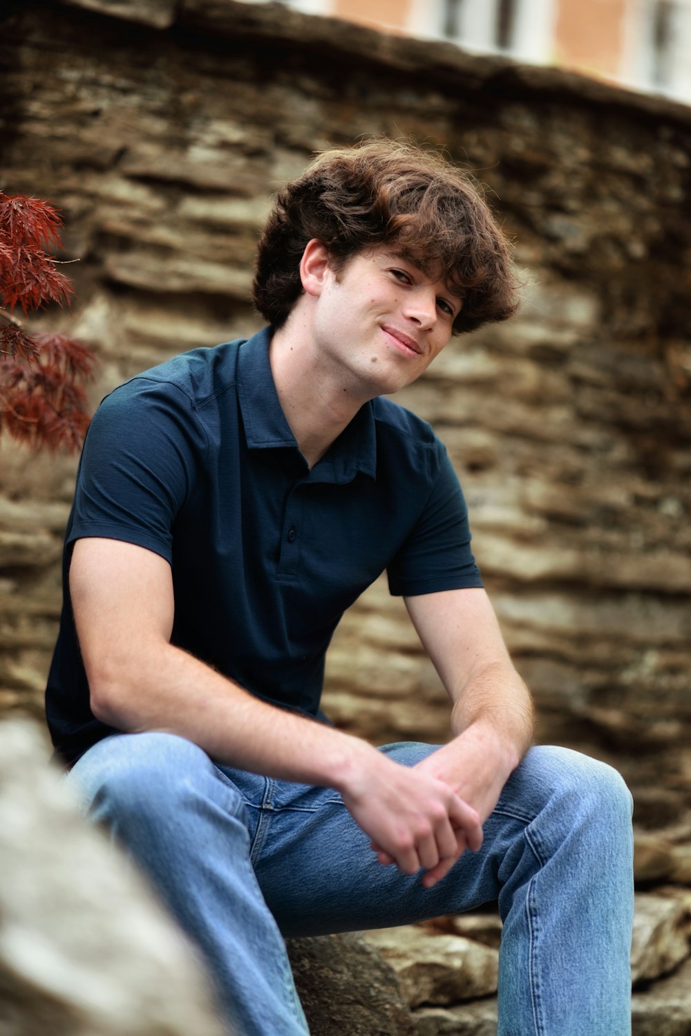 a man sitting on a rock