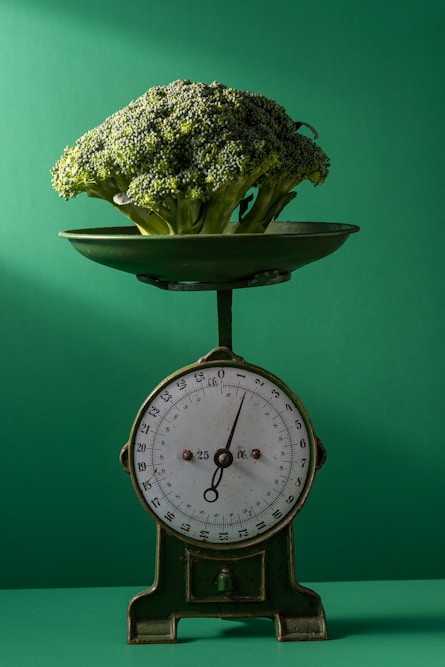 a clock with a plant on top