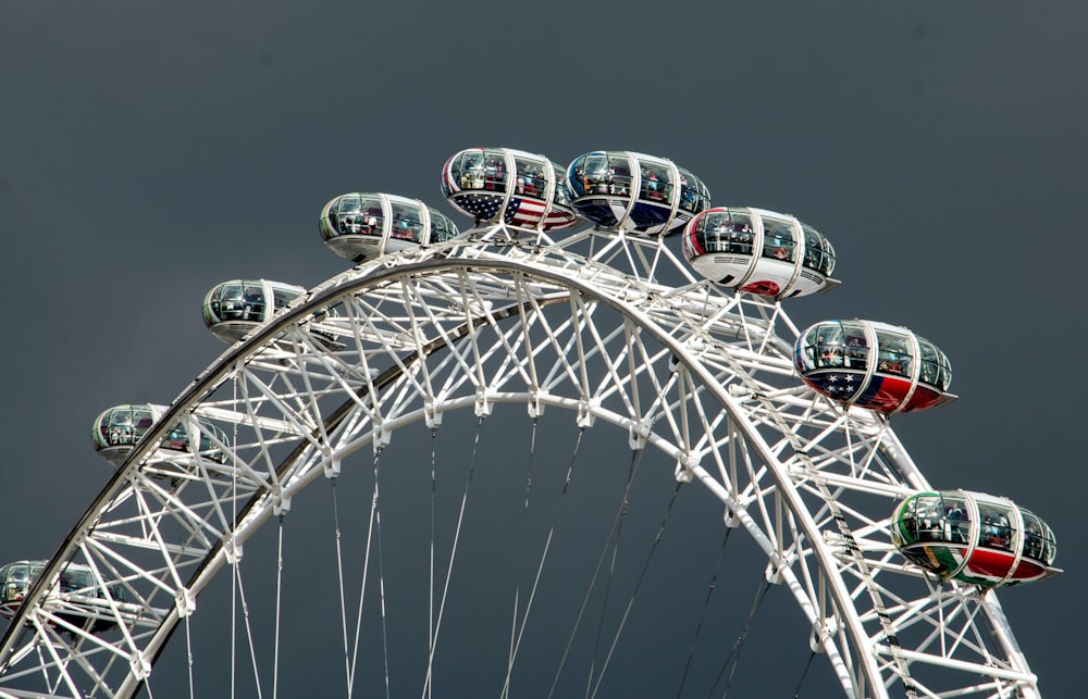 a ferris wheel with a cloudy sky