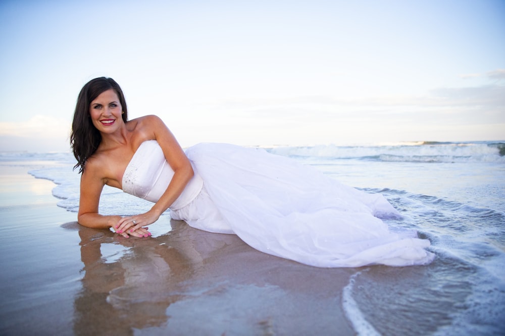 a woman sitting at a beach